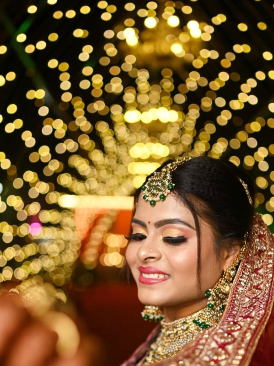 Sha lov bride on her wedding day with festive lights. Bridal Makeup Artist Bhubaneswar Cuttack Khurda
